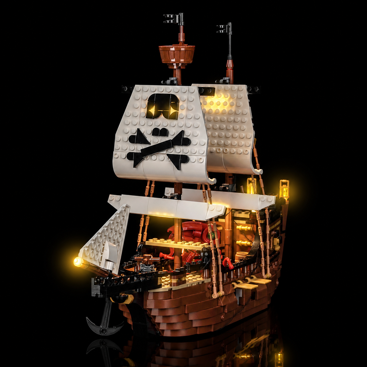 Front three-quarter view of LEGO Iconic Pirate Ship 31387 with warm lights beneath the sails