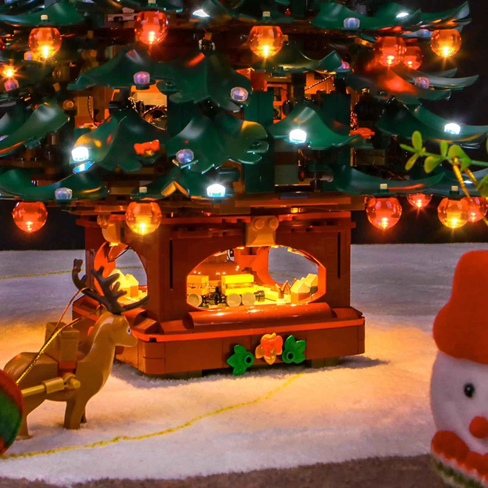 A close-up on a single branch, demonstrating how neatly the micro LEDs from the Bright My Bricks kit wrap around the tree.