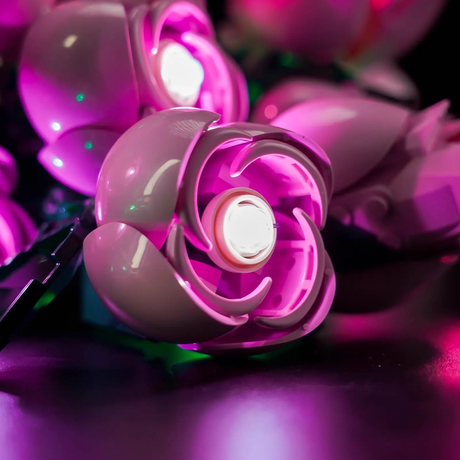 Creating a romantic atmosphere with the gently glowing LEGO Bouquet of Pink Roses on a nightstand or table.