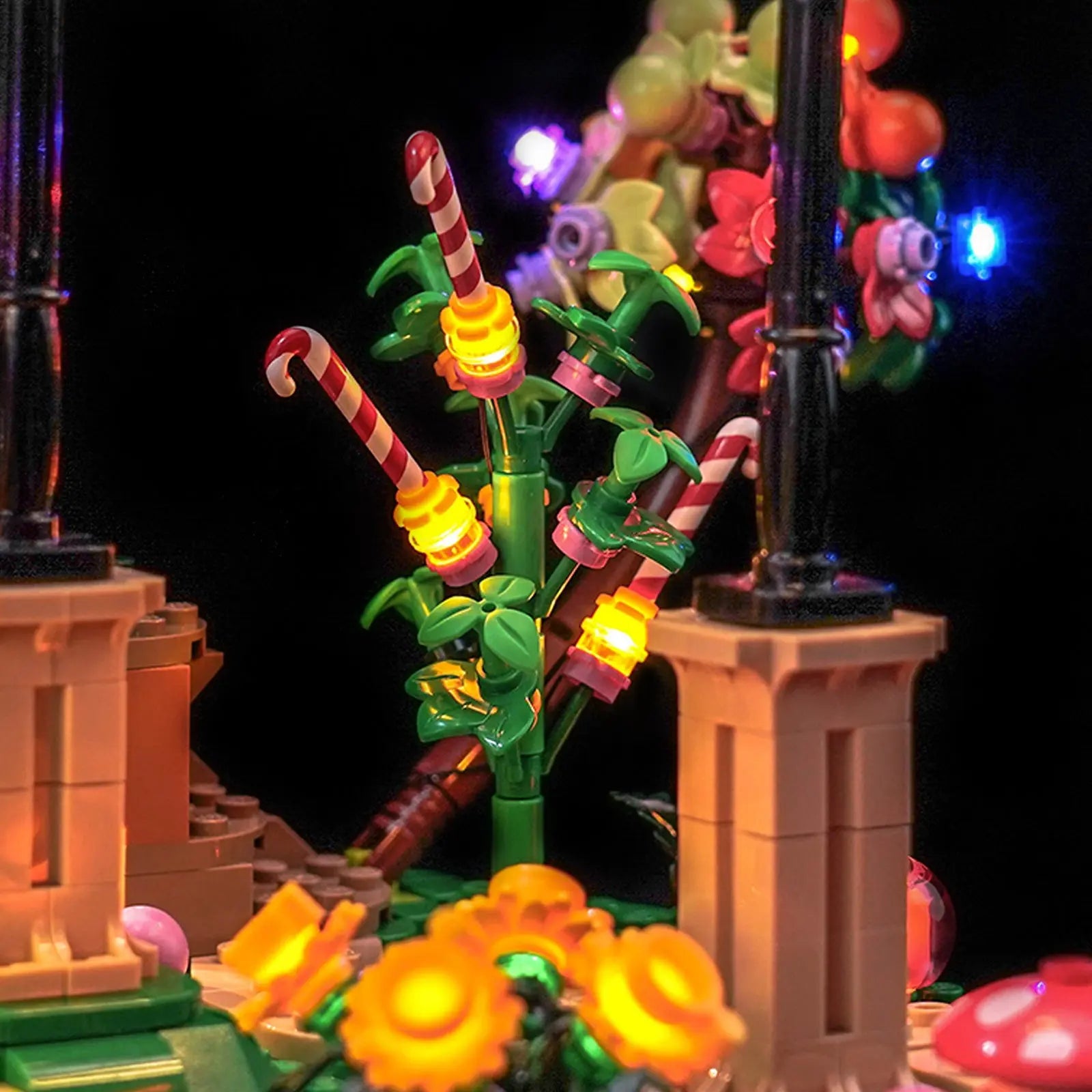 Demonstrating the remote's ability to adjust the brightness for a soft, ambient glow in the LEGO Chocolate Factory 21360.

