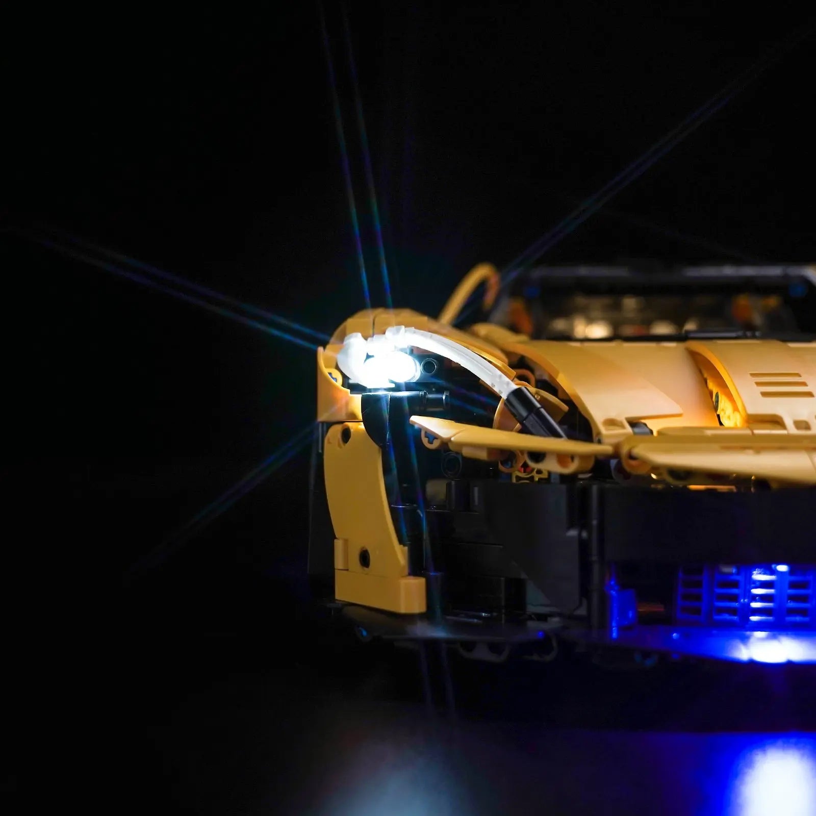 The LEGO Technic McLaren P1's lights being activated remotely, showing the convenience of the Bright My Bricks kit.