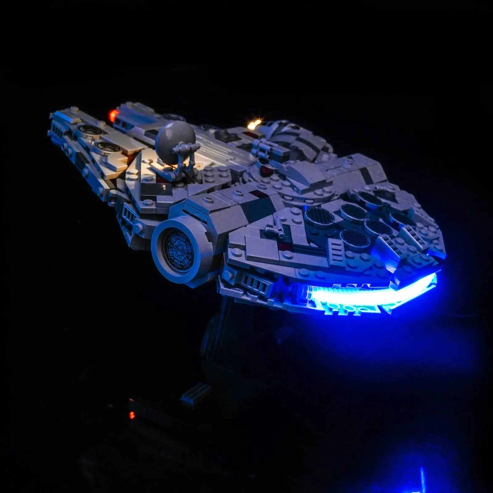 A close-up of the illuminated cockpit on the LEGO Star Wars Millennium Falcon, showing off interior lighting details.
