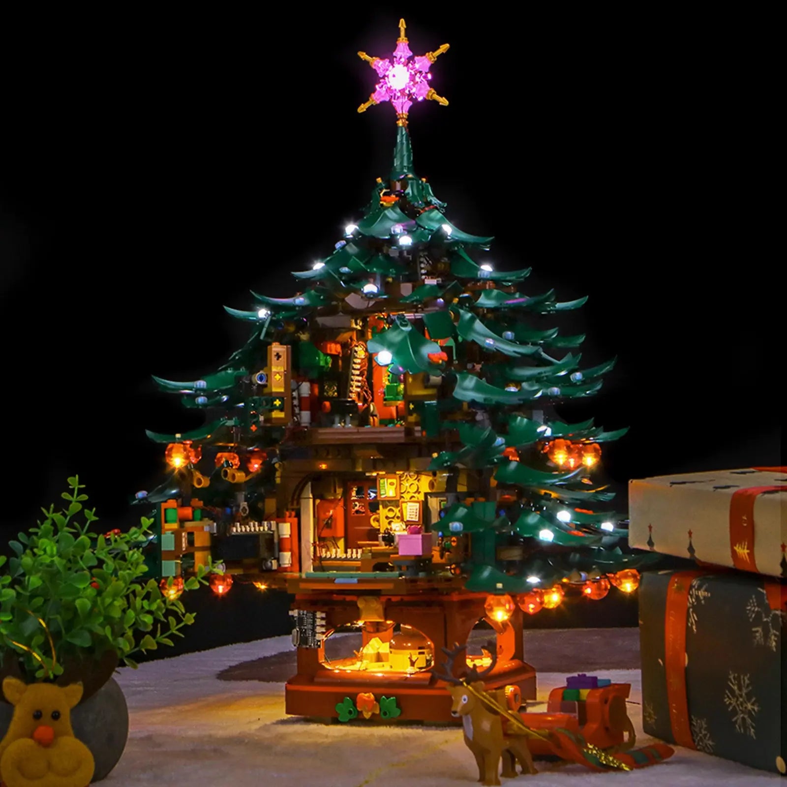 Detailed view of the colorful, illuminated ornaments on the LEGO Family Christmas Tree, each shining with festive light.