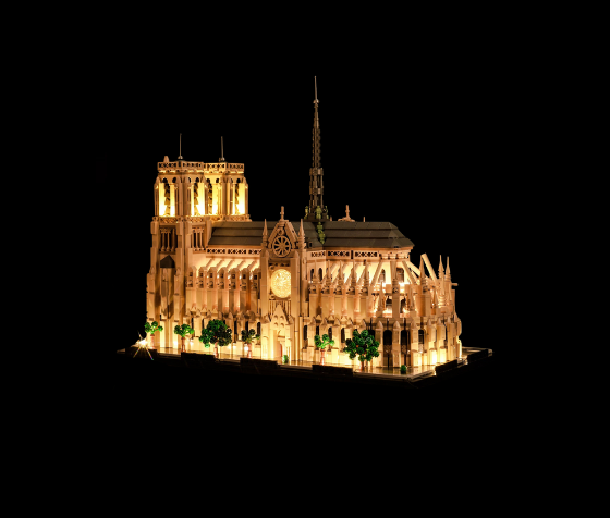 LEGO Architecture models like the Eiffel Tower and New York skyline lit up with warm white LED lights for a refined display