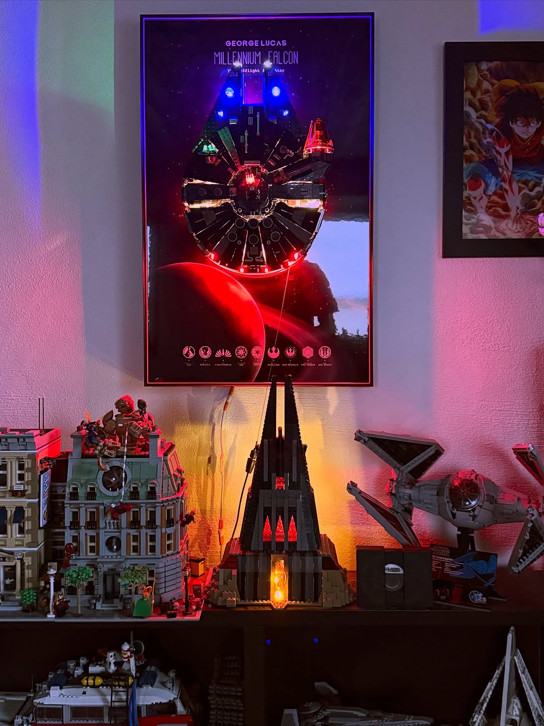 A display shelf featuring LEGO Star Wars sets illuminated with colorful LED lights from the Bright My Bricks Light Kit. The centerpiece is the LEGO Star Wars The Dark Falcon 75389 set, showcased with dramatic lighting effects. Other LEGO models, including city buildings and a TIE Fighter, are also accented with light. A poster above the shelf displays the Millennium Falcon with integrated LED lights, adding a galactic atmosphere to the scene.