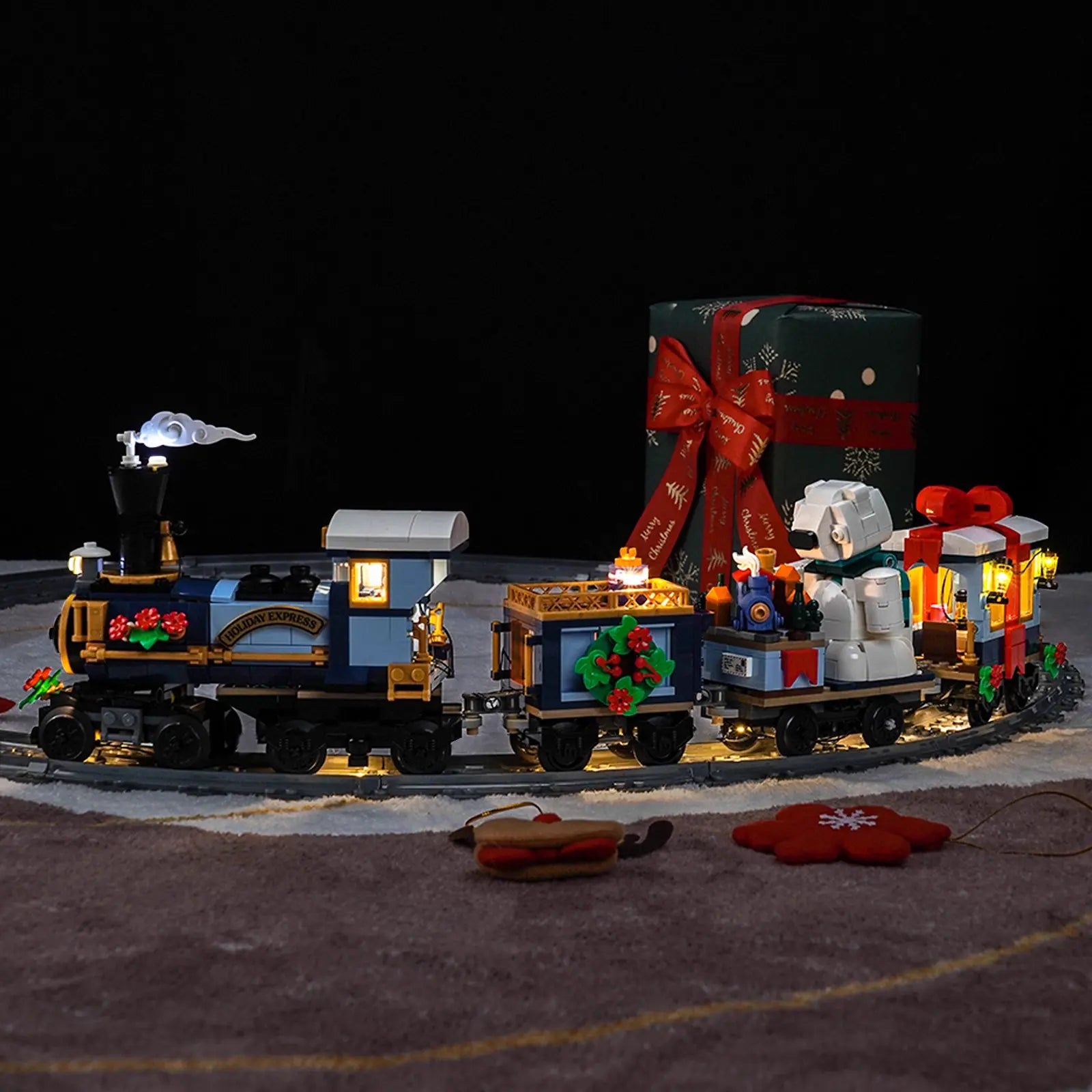 The caboose of the LEGO Holiday Express Train 10361 is lit up with a cozy, festive glow from the Bright My Bricks light kit.