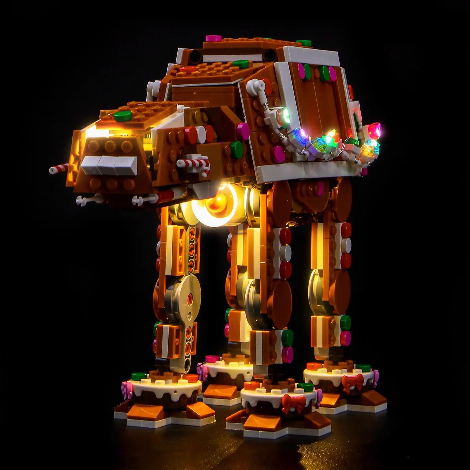 A close-up of the Gingerbread AT-AT's head, with glowing red candy "laser cannons" from the Bright My Bricks light kit.