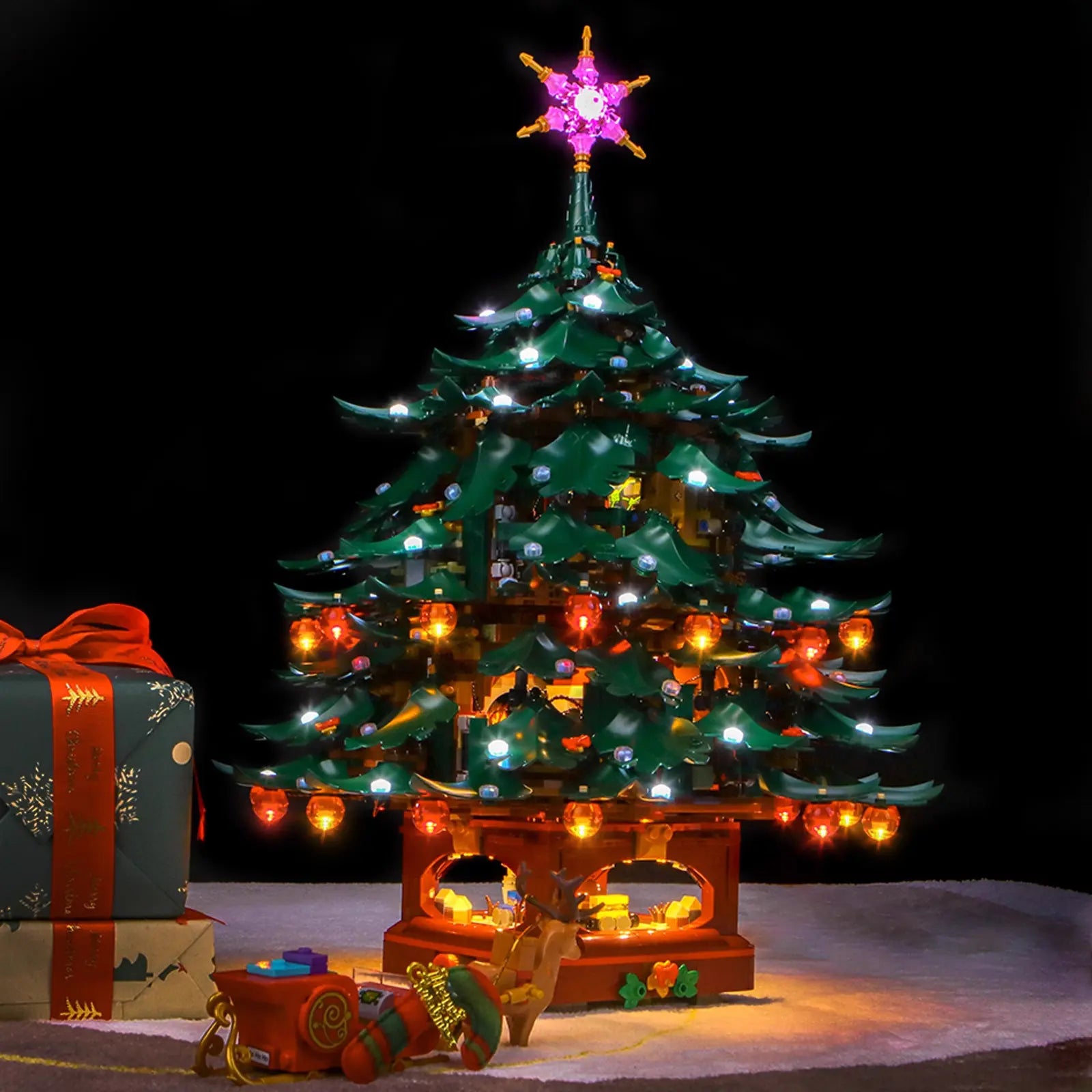 The illuminated LEGO Christmas Tree 41843 serves as the perfect holiday centerpiece in a cozy living room setting.