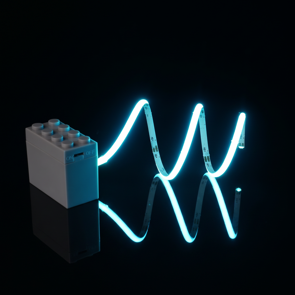 Ice blue COB LED strip powered beside a brick-style battery box