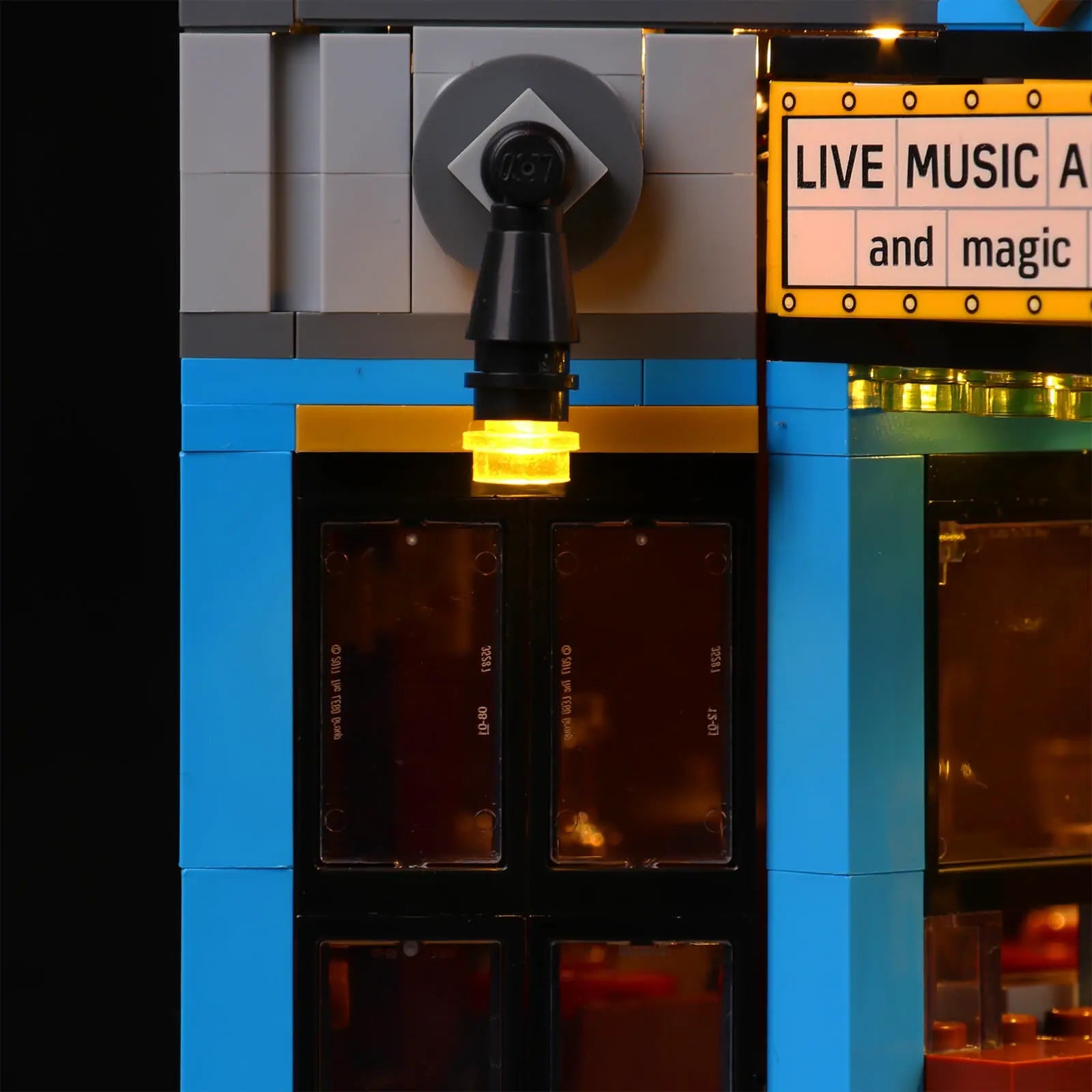 The iconic 'JAZZ CLUB' sign on the LEGO 10312 model brilliantly lit, creating a stunning display piece by Bright My Bricks.