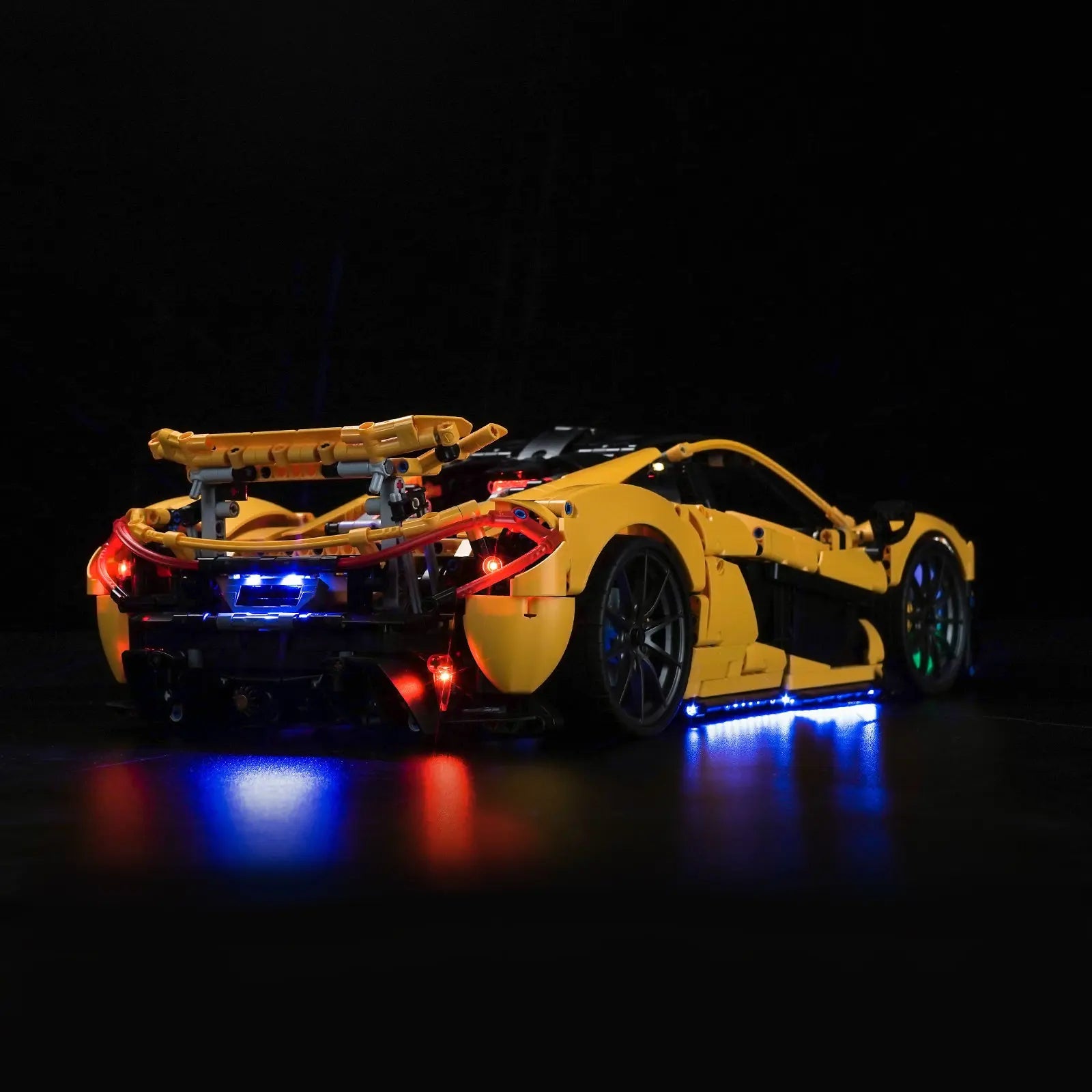 The interior cockpit and dashboard of the LEGO Technic McLaren P1 cast in a realistic glow by Bright My Bricks lights.