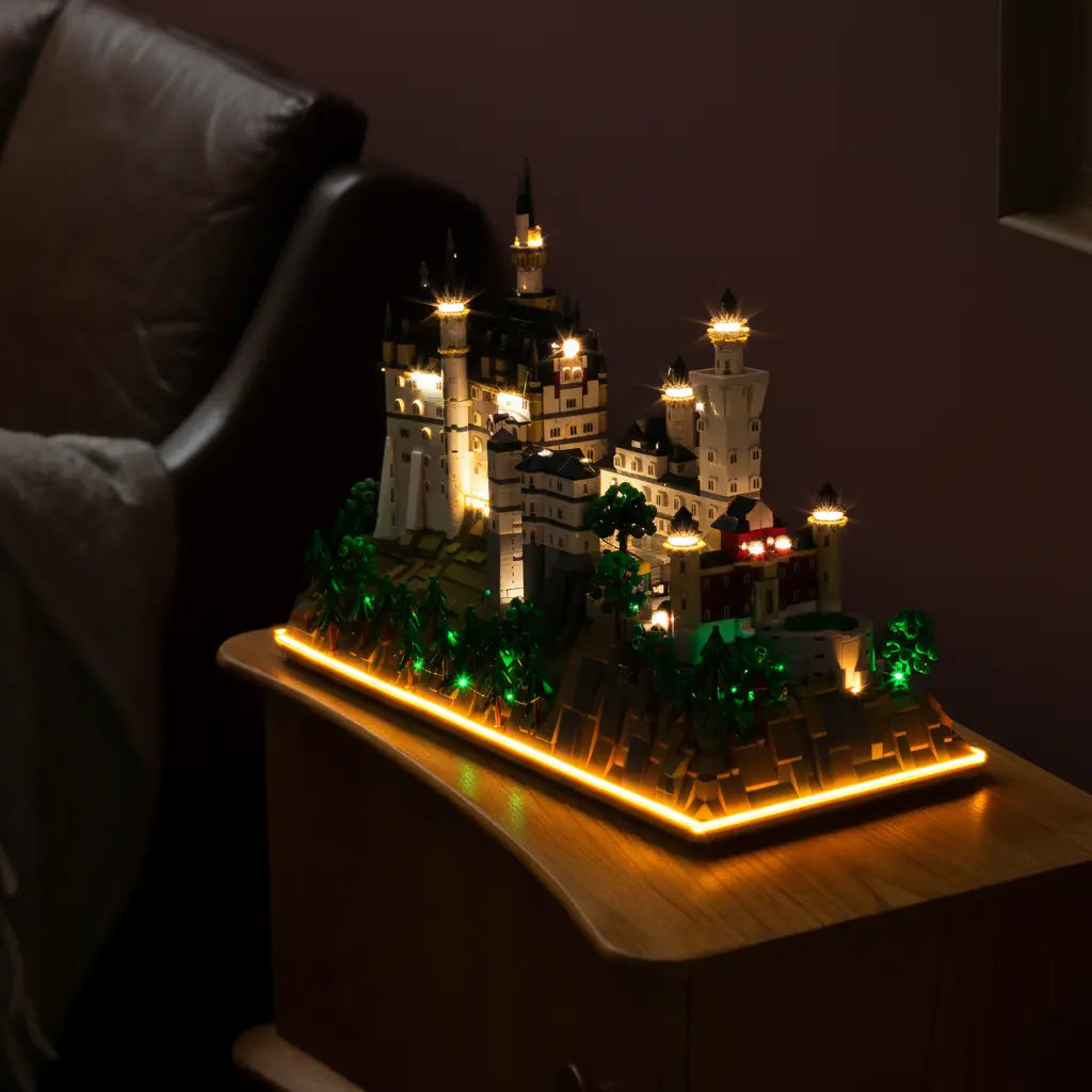 The magnificent LEGO Architecture Neuschwanstein Castle 21063 illuminated to create a stunning, magical display piece.