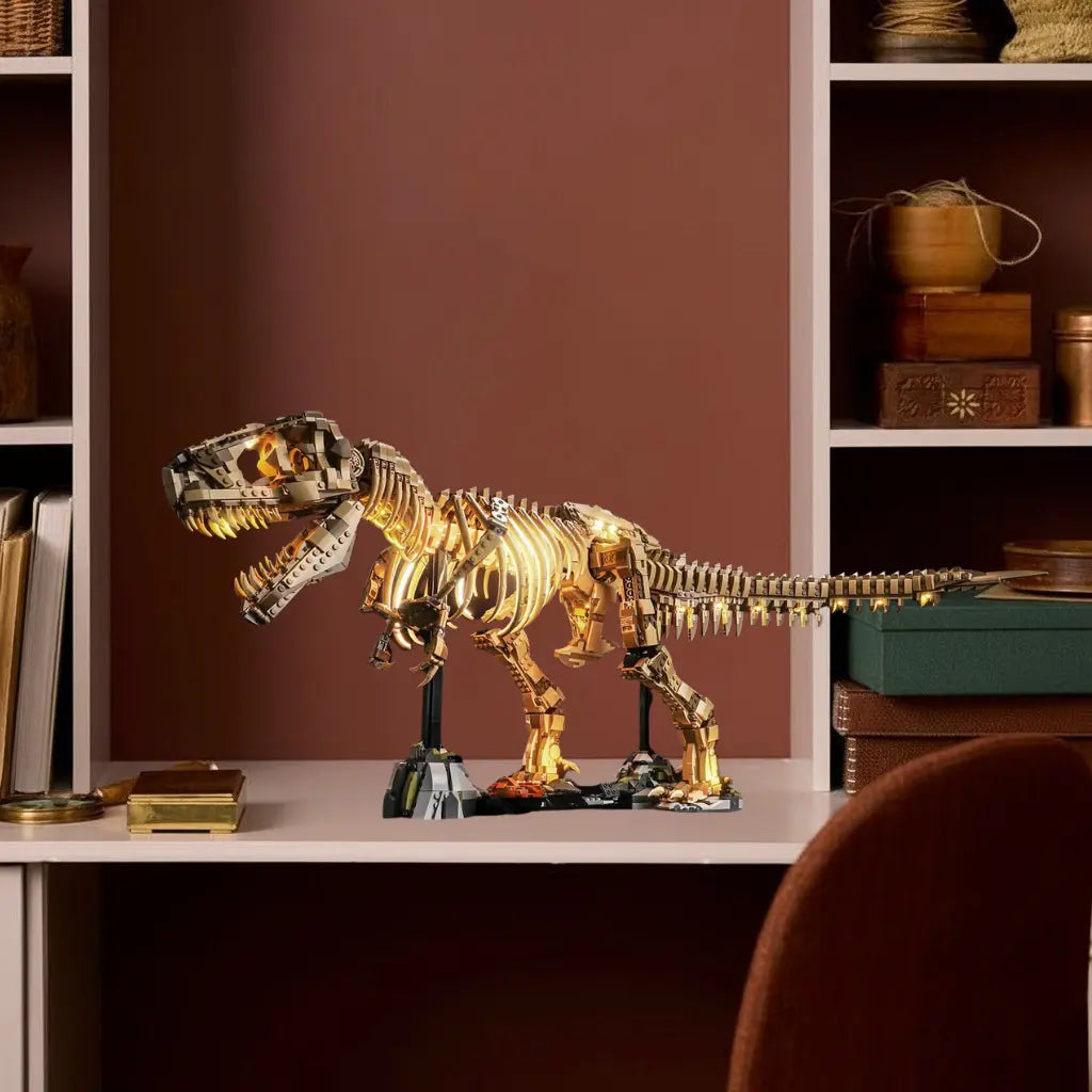 The LEGO T-rex fossil skeleton 76968 dramatically illuminated by a Bright My Bricks LED light kit on a modern bookshelf.