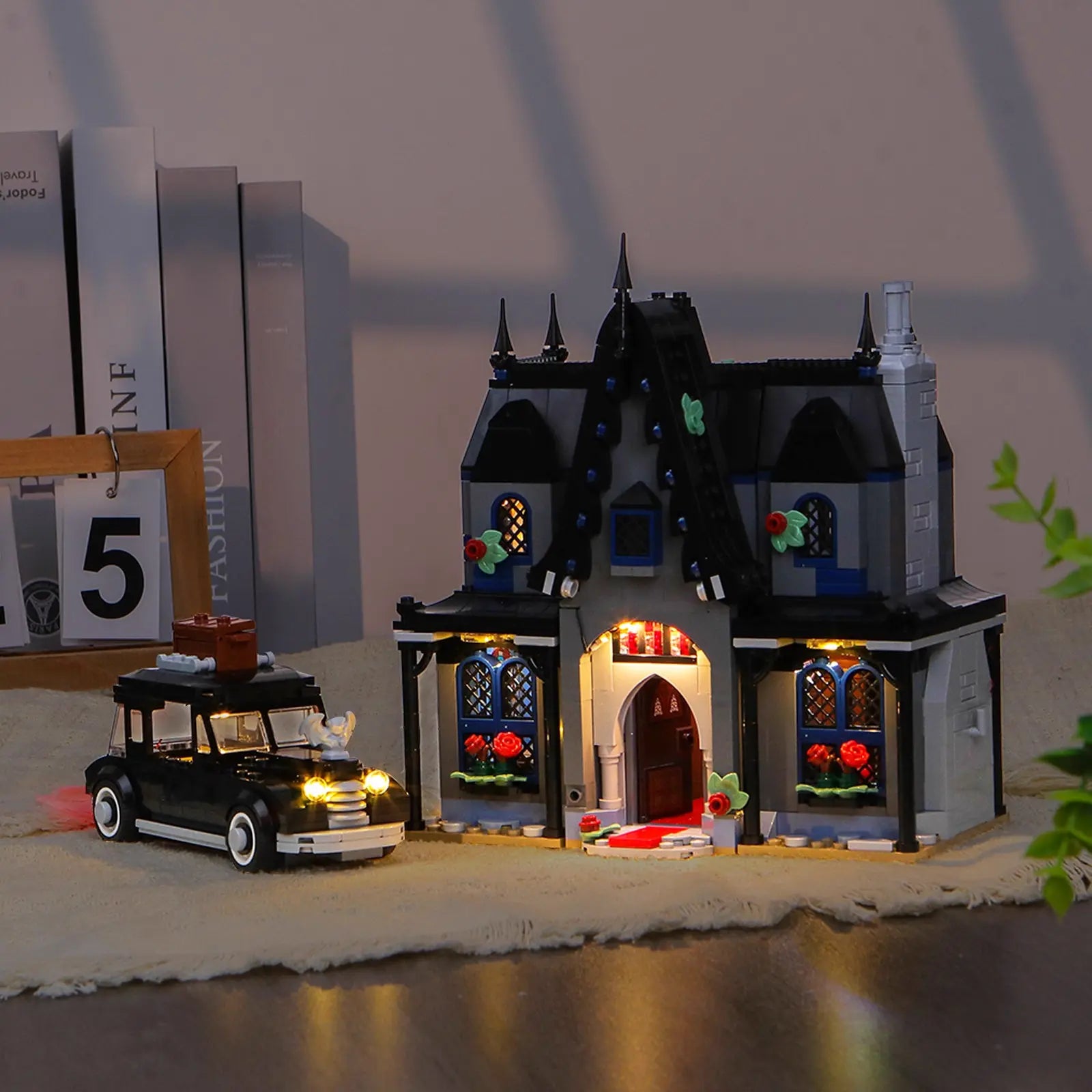 The LEGO Morticia's Cottage 76786 is illuminated with a spooky, custom LED light kit by Bright My Bricks.