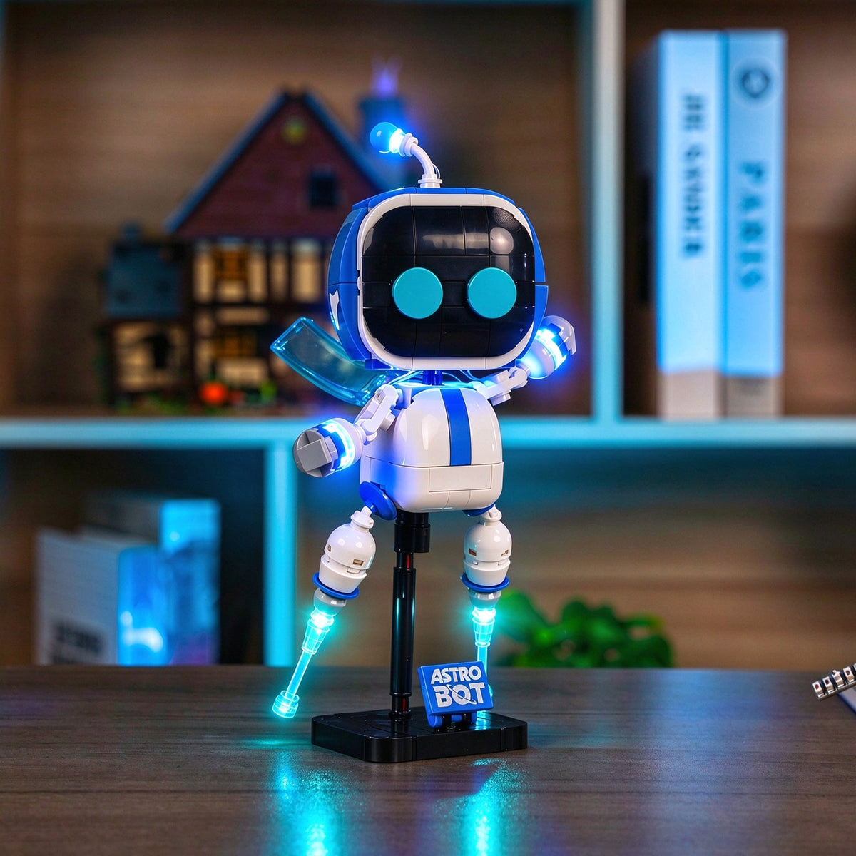 LEGO® Astro Bot™ #40899 — illuminated figure displayed in a bookshelf setting
