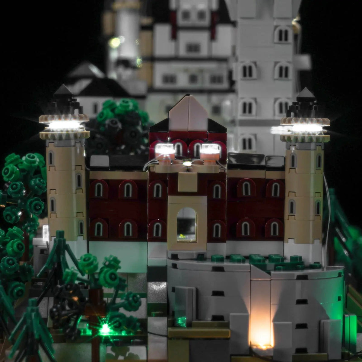 LEGO® Architecture Neuschwanstein Castle #21063 fully illuminated on display, with the LED lighting kit