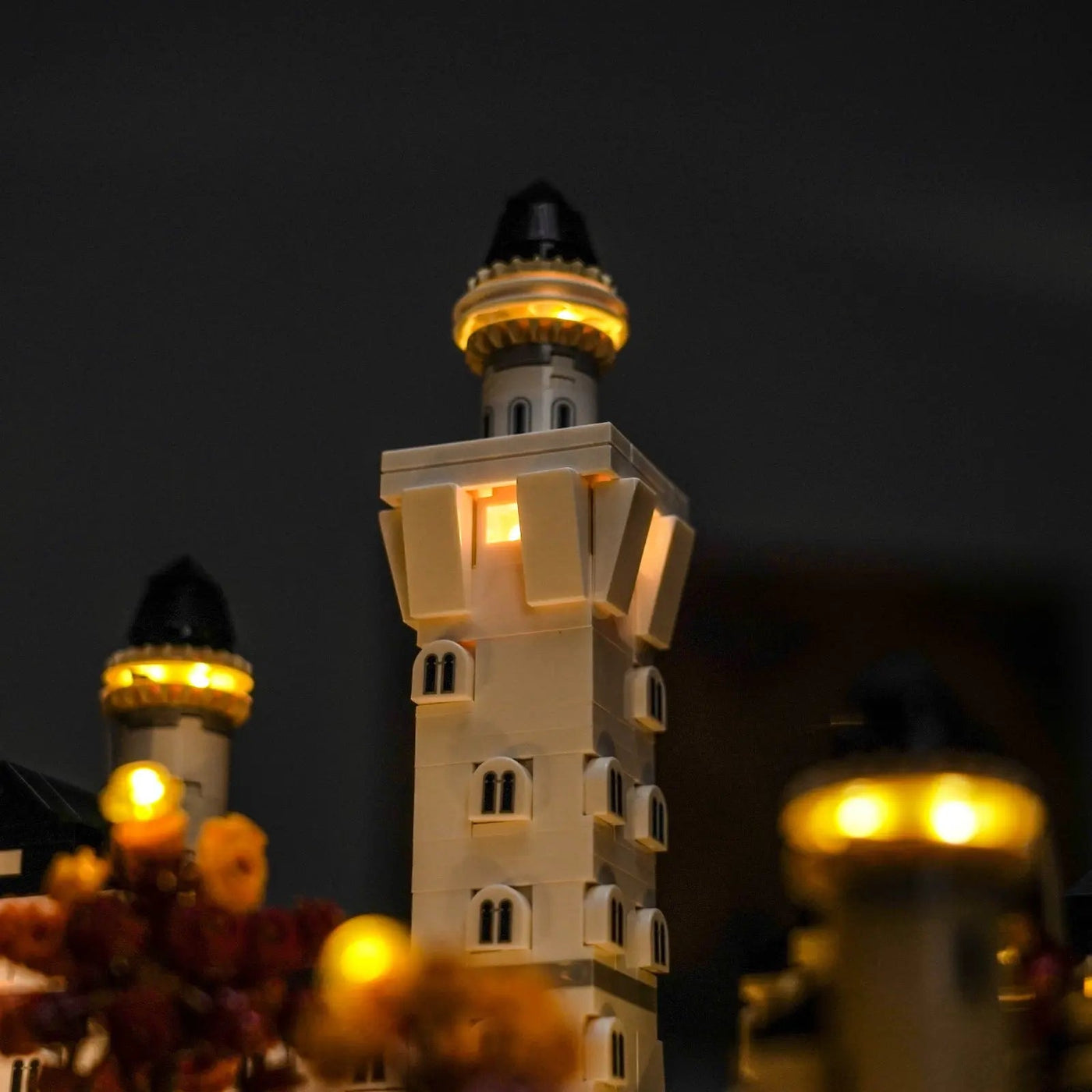 LEGO® Architecture Neuschwanstein Castle #21063 fully illuminated on display, with the LED lighting kit