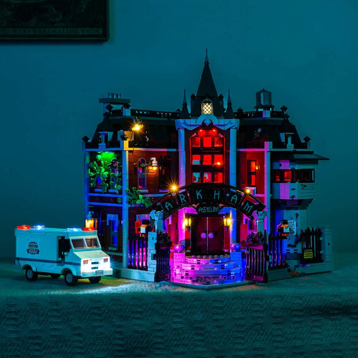 LEGO® Batman Arkham Asylum #76300 illuminated at night, with the RGB LED light kit