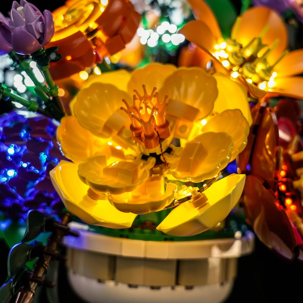 LEGO® Botanicals Flower Arrangement #10345 — fully illuminated on display (LED lights)
