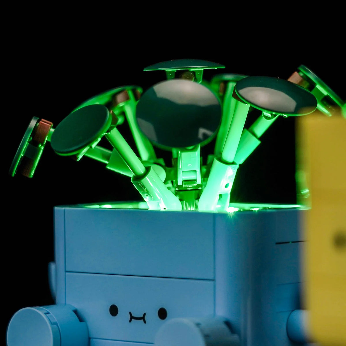 LEGO® Botanicals Happy Plants #10349 illuminated at night, with the custom LED lighting