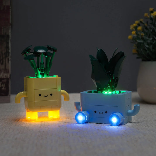 LEGO® Botanicals Happy Plants #10349 fully illuminated on display, with the custom LED lighting