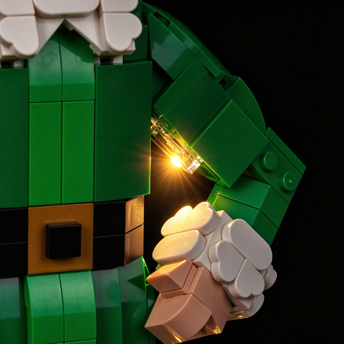 Warm lighting detail around the hand of LEGO® Buddy the Elf #40865