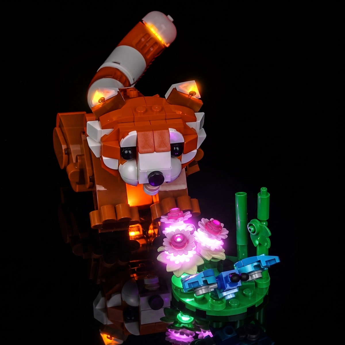 the flower base lit in pink and green: Bright My Bricks LED lighting kit for LEGO® Creator Cute Animals: Red Panda #31394