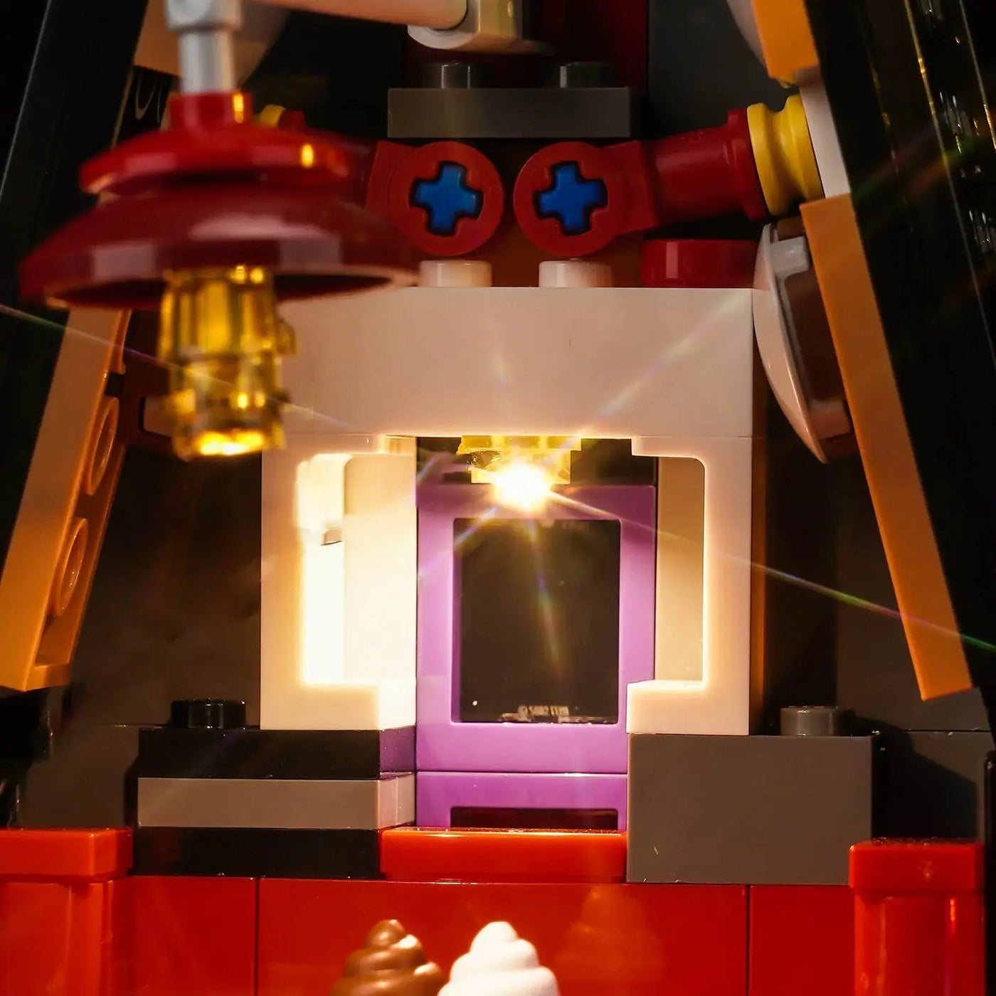 LEGO® Despicable Me 4 Minions and Gru’s Family Mansion #75583 illuminated at night, with the RGB LED light kit
