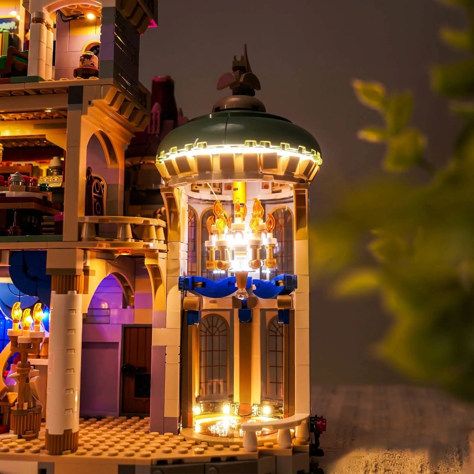 LEGO Disney Beauty and the Beast Castle #43263 illuminated at night