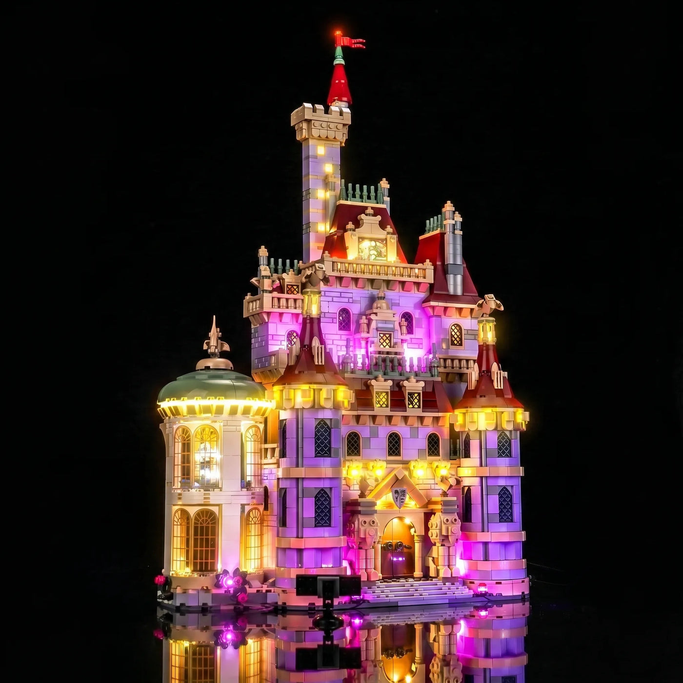 LEGO® Disney Beauty and the Beast Castle #43263 illuminated at night, with the premium LED light kit