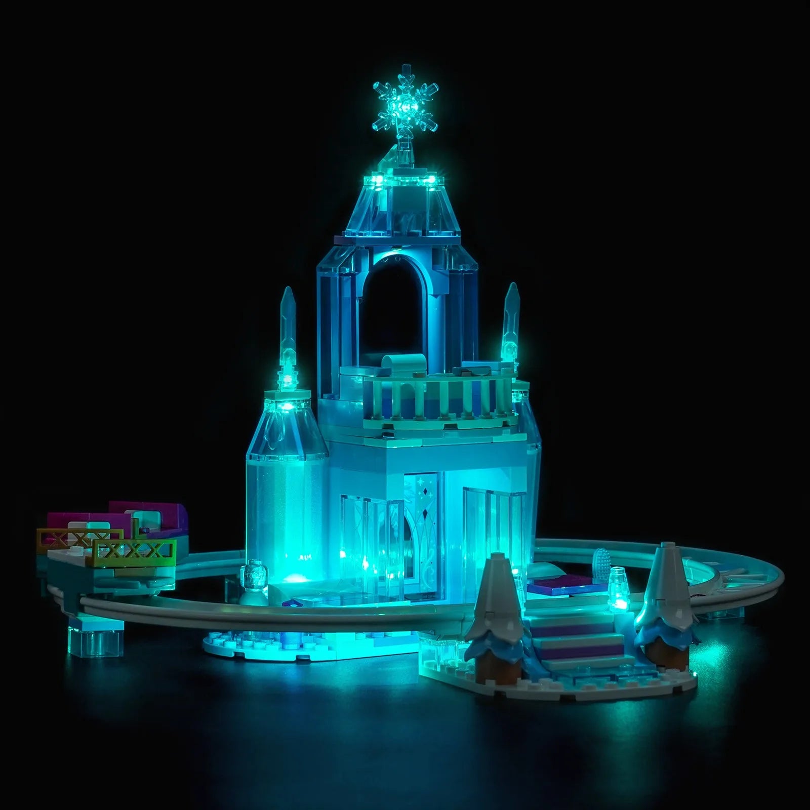 LEGO Disney Elsa's Ice Castle & Snow Ride Adventure #43281 illuminated at night