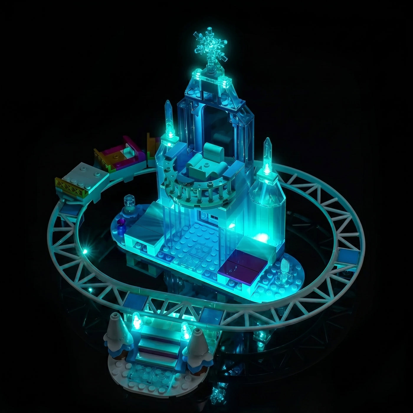 LEGO® Disney Elsa's Ice Castle & Snow Ride Adventure #43281 fully illuminated on display, with the light kit