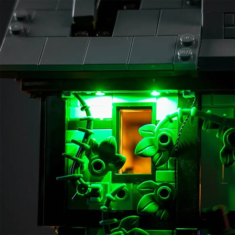 LEGO® Disney Hocus Pocus: The Sanderson Sisters' Cottage #21341 warm LED glow detail, with the light kit