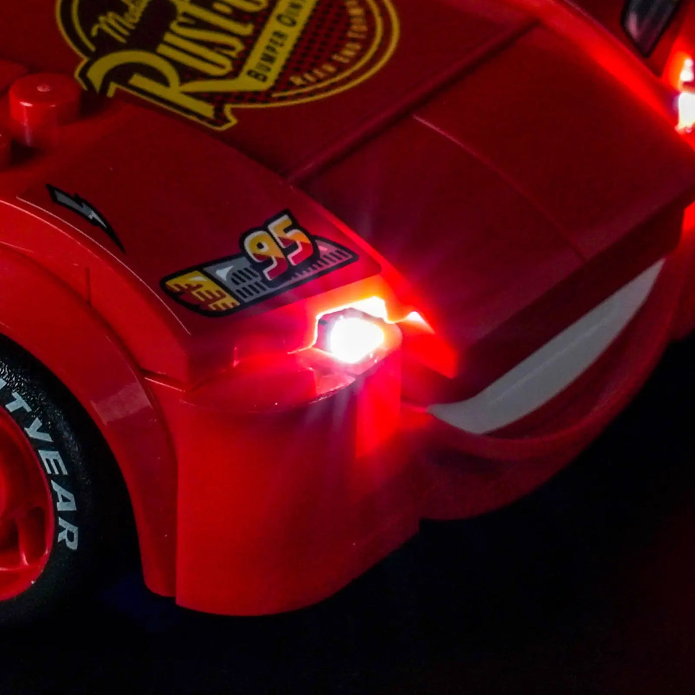 side angle with lights on: Bright My Bricks display light kit for LEGO® Disney Lightning McQueen #77255