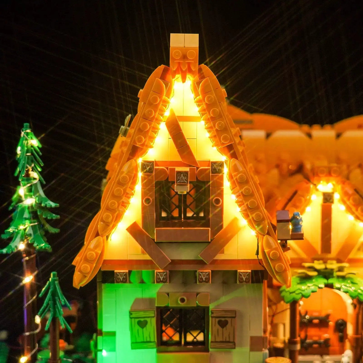 LEGO® Disney Snow White Cottage #43242 illuminated at night, with the DIY LED light kit
