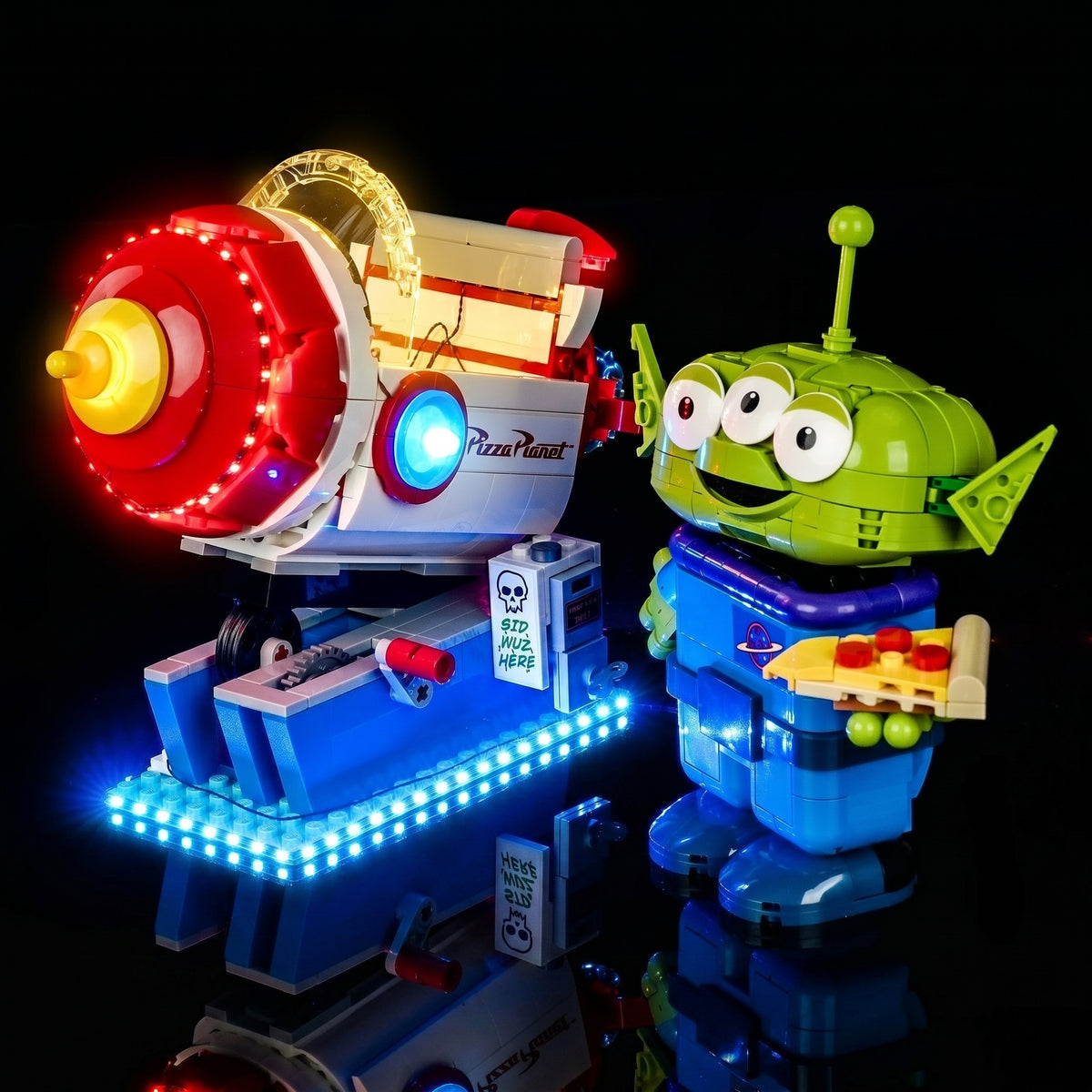 LEGO® Disney Toy Story Alien with Pizza Planet Rocket Ride #43307 — front view fully lit (LED lights)