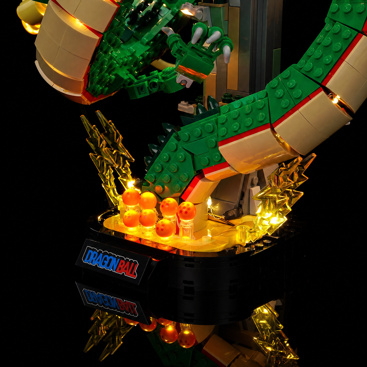 Close-up of the Dragon Balls along the warm-lit display base — LEGO® Dragon Ball: Shenron & Goku #11390, LED light kit