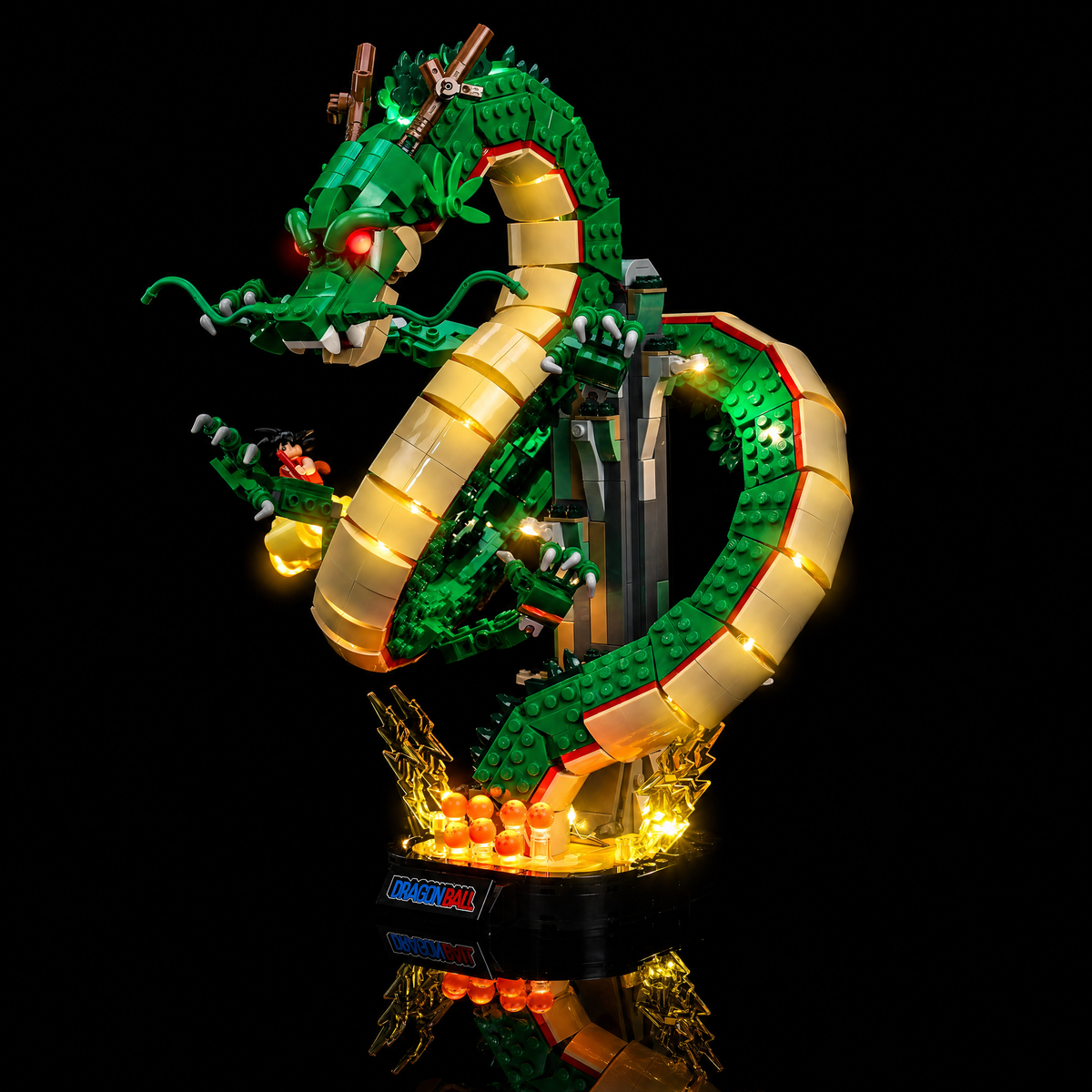 Full three-quarter view on black with the lit dragon, cloud and base — LEGO® Dragon Ball: Shenron & Goku #11390, LED light kit