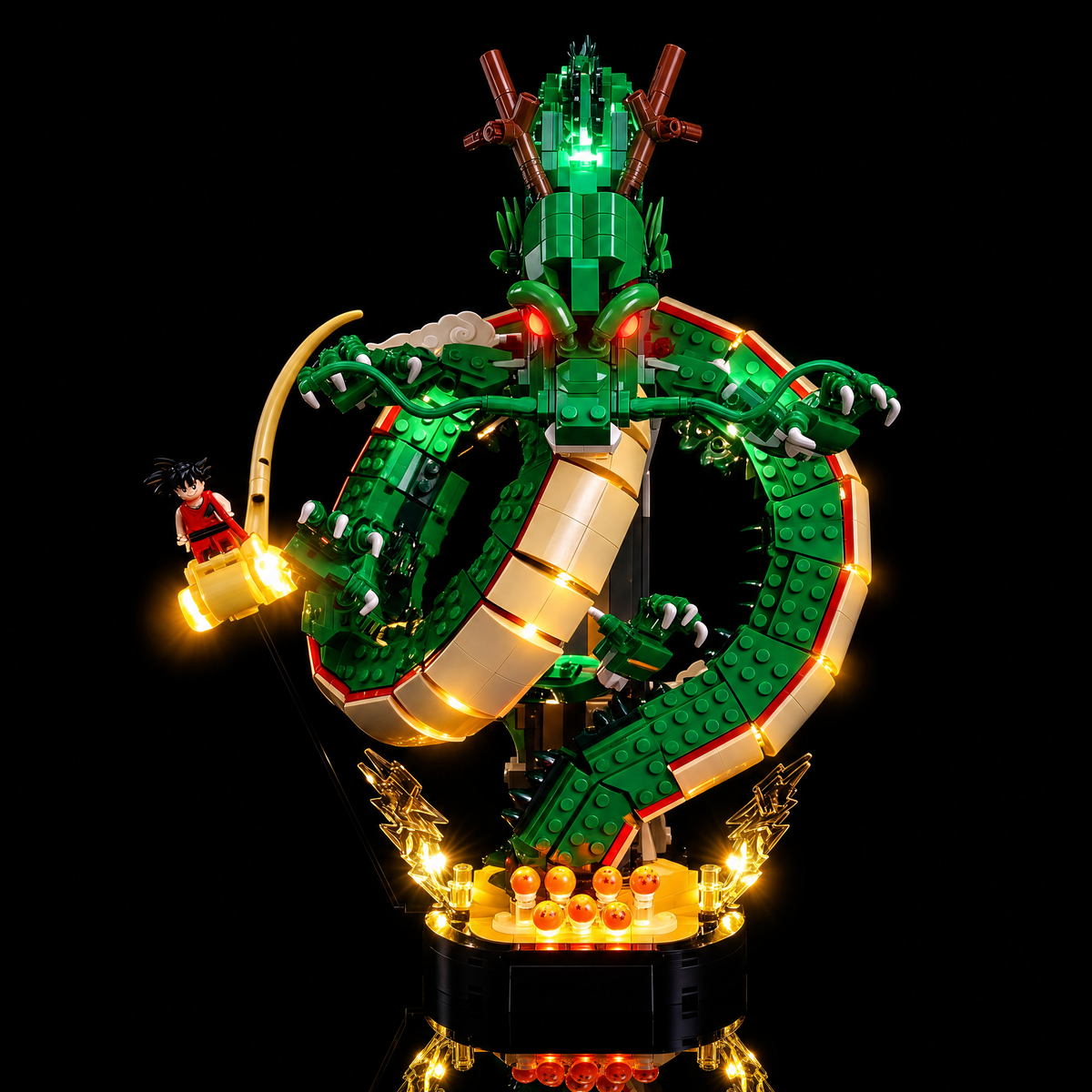 Low front angle showing green head accents and the illuminated base — LEGO® Dragon Ball: Shenron & Goku #11390, LED light kit
