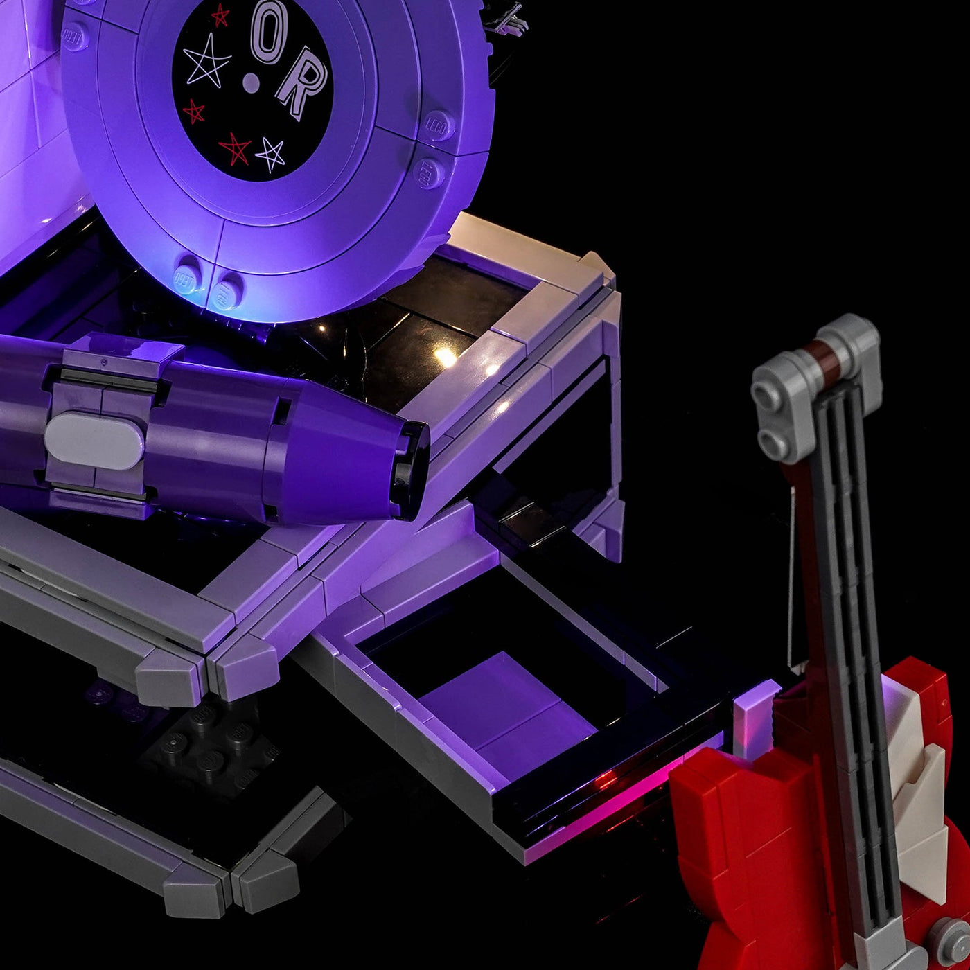 LEGO® Editions Olivia Rodrigo's Secret Storage #43030 display lighting in a dark room, with the premium LED light kit