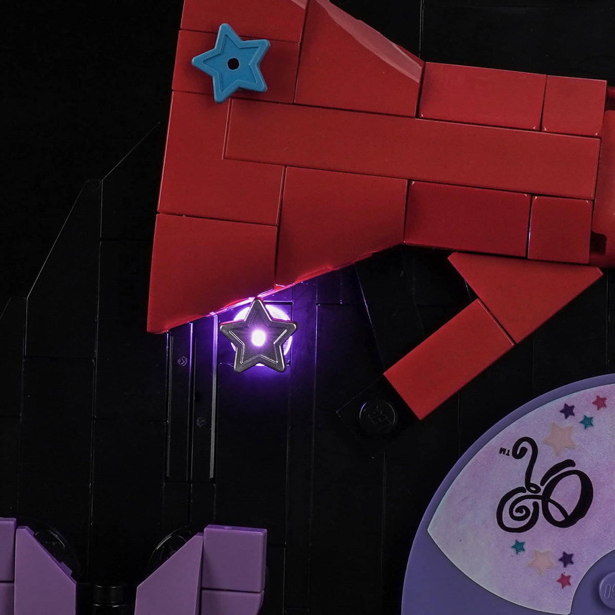 LEGO® Editions Olivia Rodrigo's Vinyl #43028 display lighting in a dark room, with the premium LED light kit