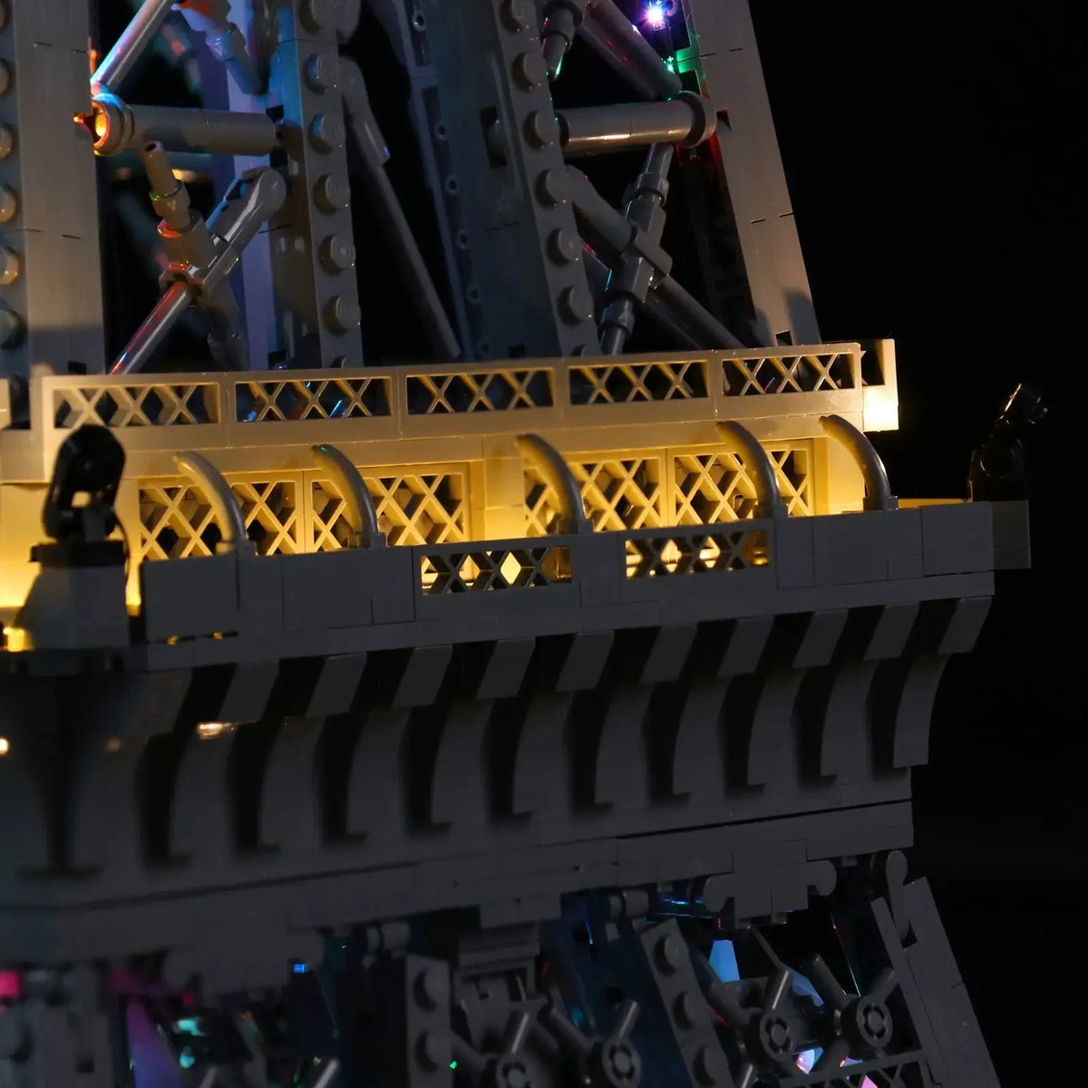 LEGO® Eiffel Tower #10307 fully illuminated on display, with the DIY LED light kit