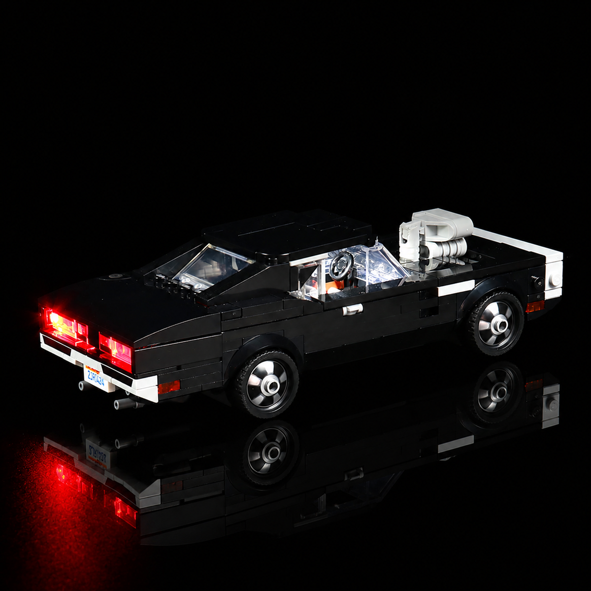 LEGO® Fast & Furious 1970 Dodge Charger R/T #76912 — side angle with lights on (LED lights)