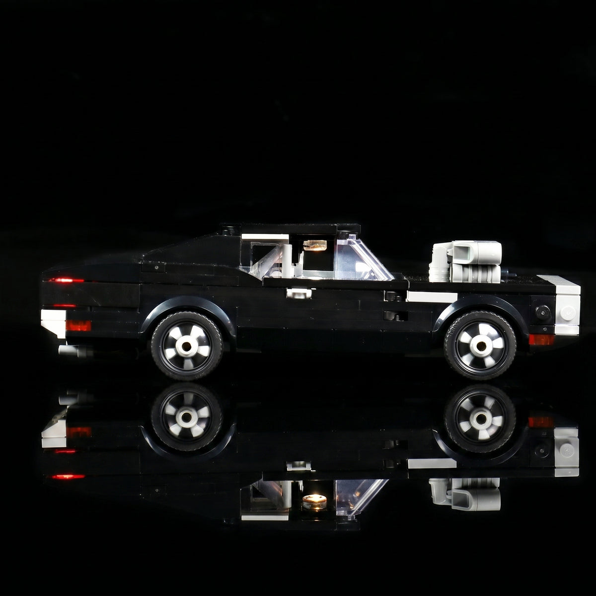 LEGO® Fast & Furious 1970 Dodge Charger R/T #76912 illuminated at night, with the LED lighting kit