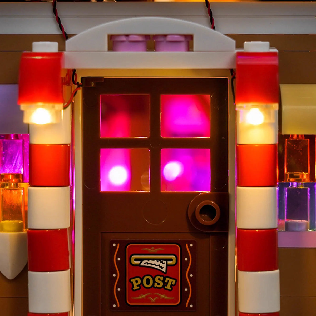 LEGO® Festive Gingerbread House #40809 night-mode display glow, with the custom LED lighting