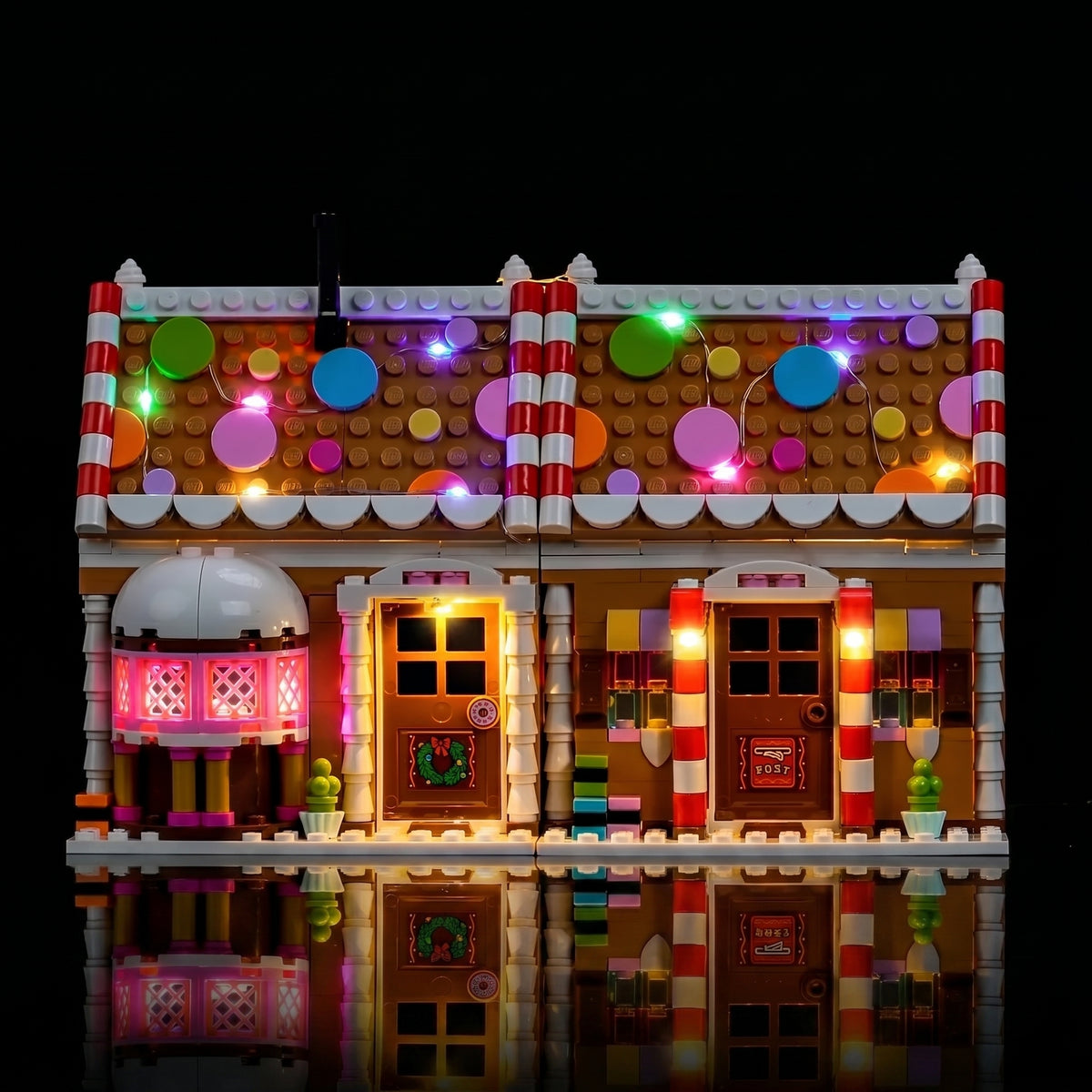 LEGO® Festive Gingerbread House #40809 front view fully lit, with the premium LED light kit
