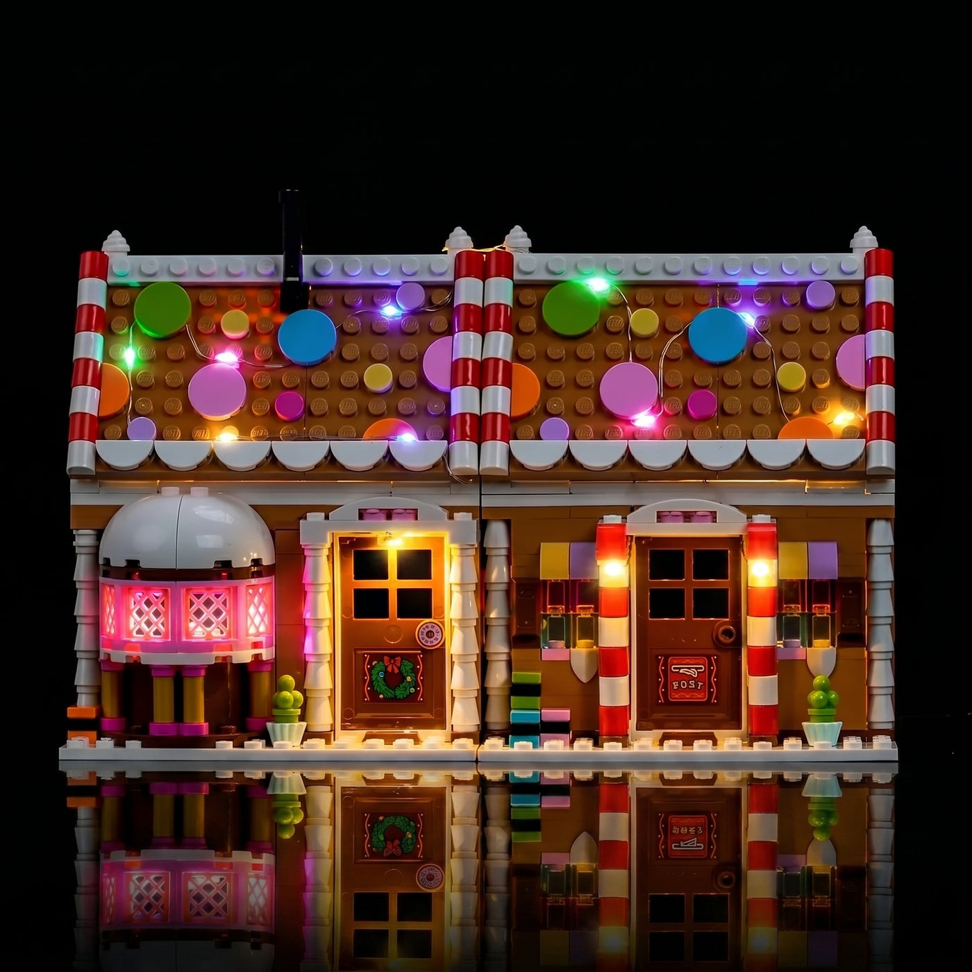 LEGO® Festive Gingerbread House #40809 front view fully lit, with the premium LED light kit