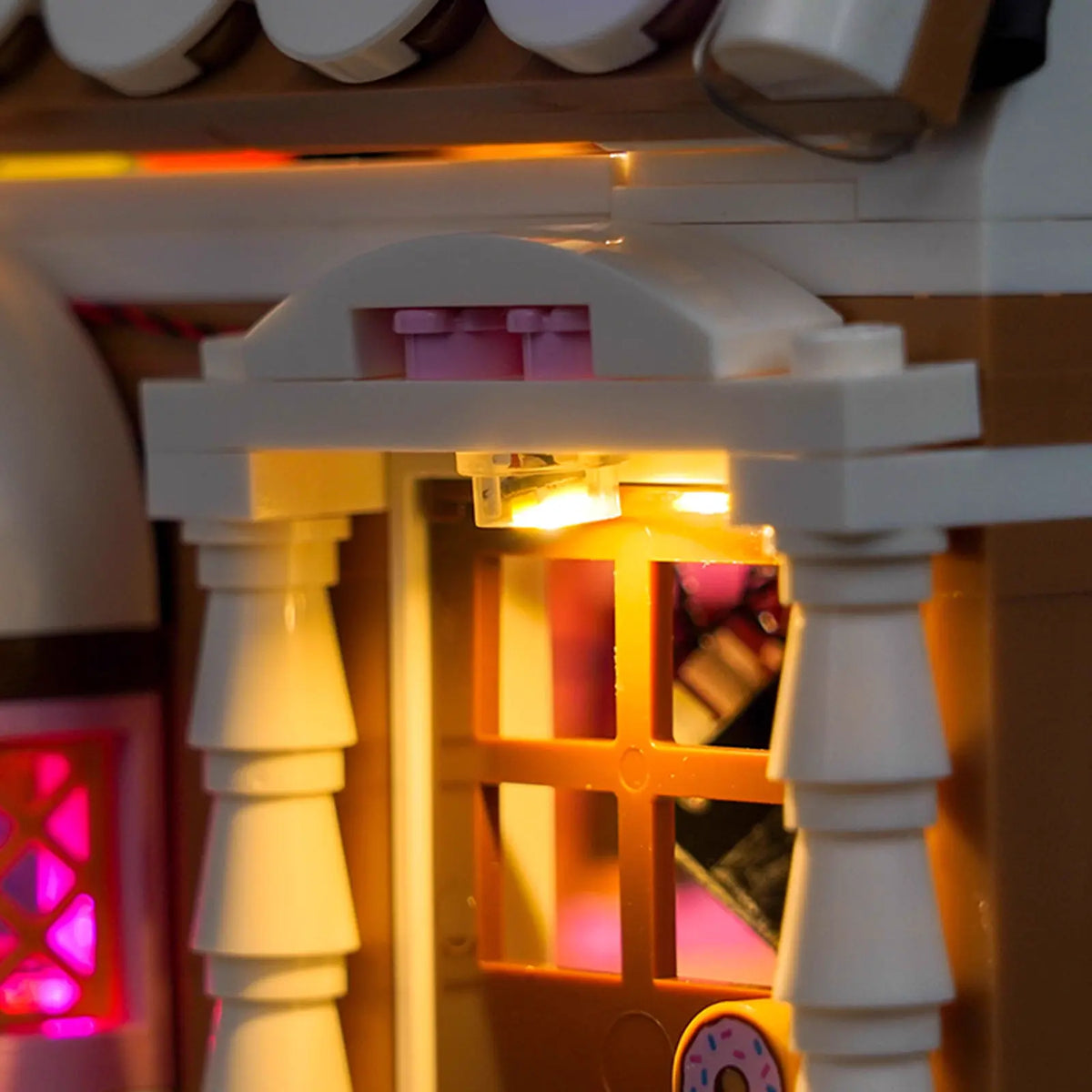 LEGO® Festive Gingerbread House #40809 front view fully lit, with the USB-powered LED light kit