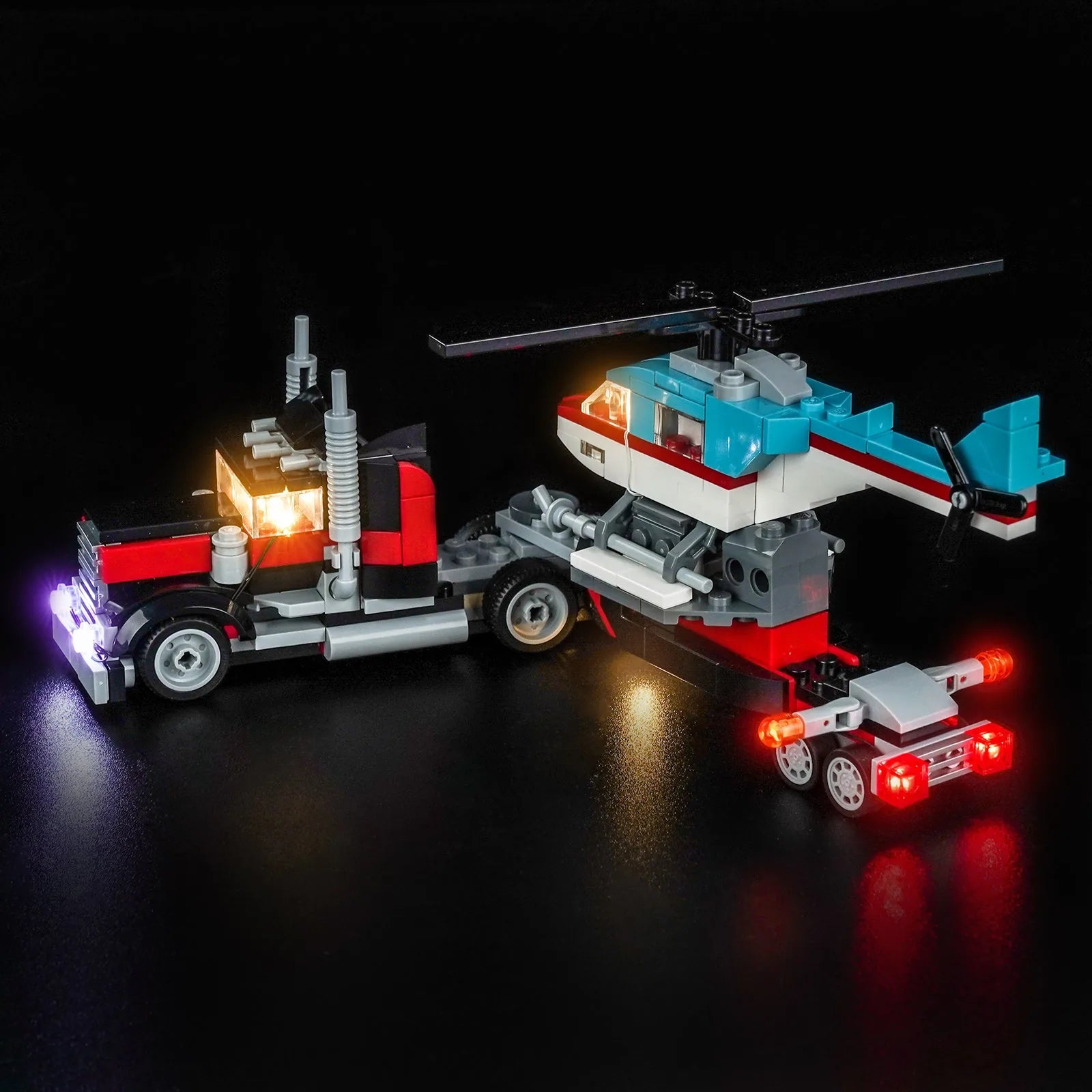 LEGO Flatbed Truck with Helicopter #31146 illuminated at night