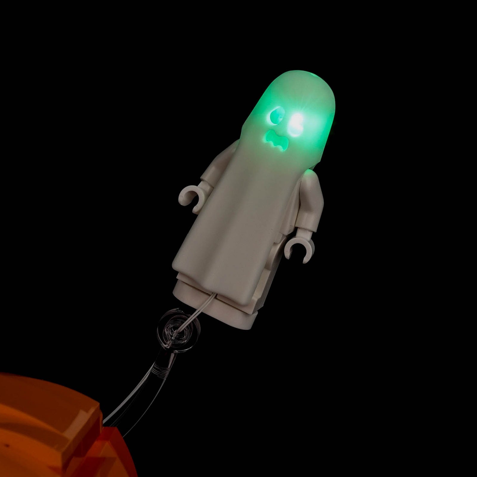 LEGO® Halloween Pumpkin Lantern #40872 display lighting in a dark room, with the premium LED light kit
